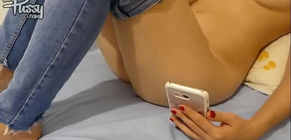  Amateur girl is watching porn on her phone and masturbating